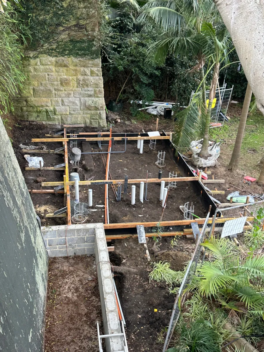 Plumbing rough-in and pipework before a new concrete slab